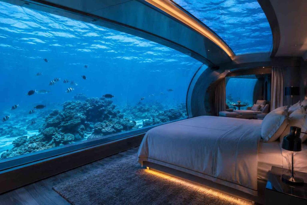 Underwater hotel suite in the Maldives with panoramic ocean view through glass walls