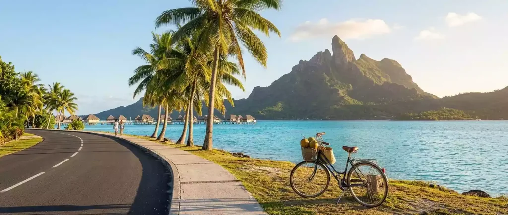 Bicycle on Bora Bora's coastal road with Mount Otemanu in the background
