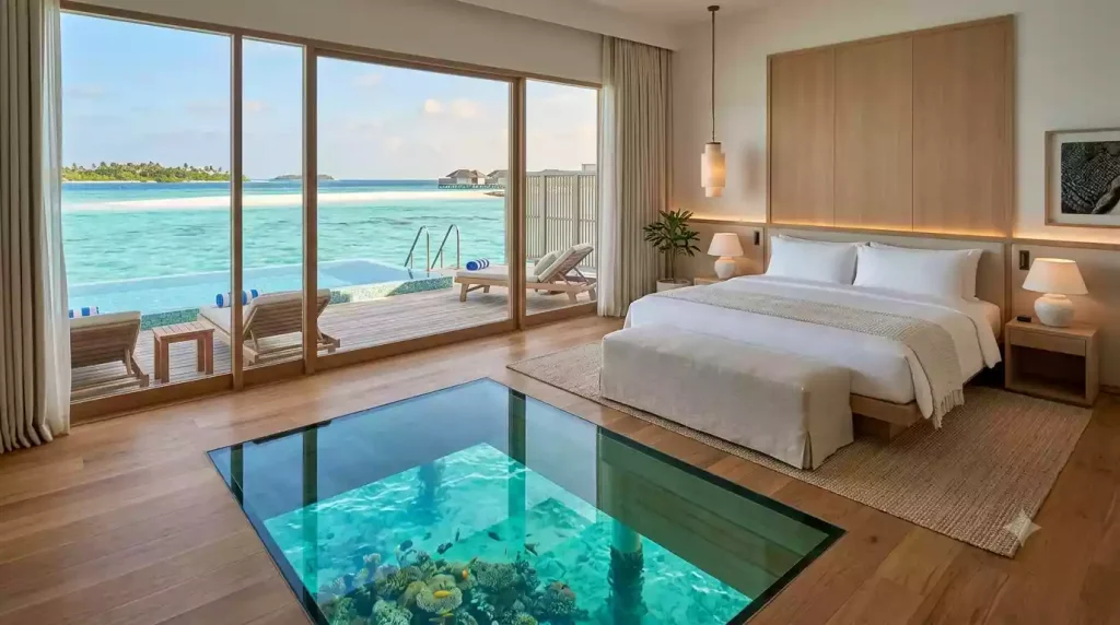 Interior of a luxury overwater villa with glass floor in the Maldives