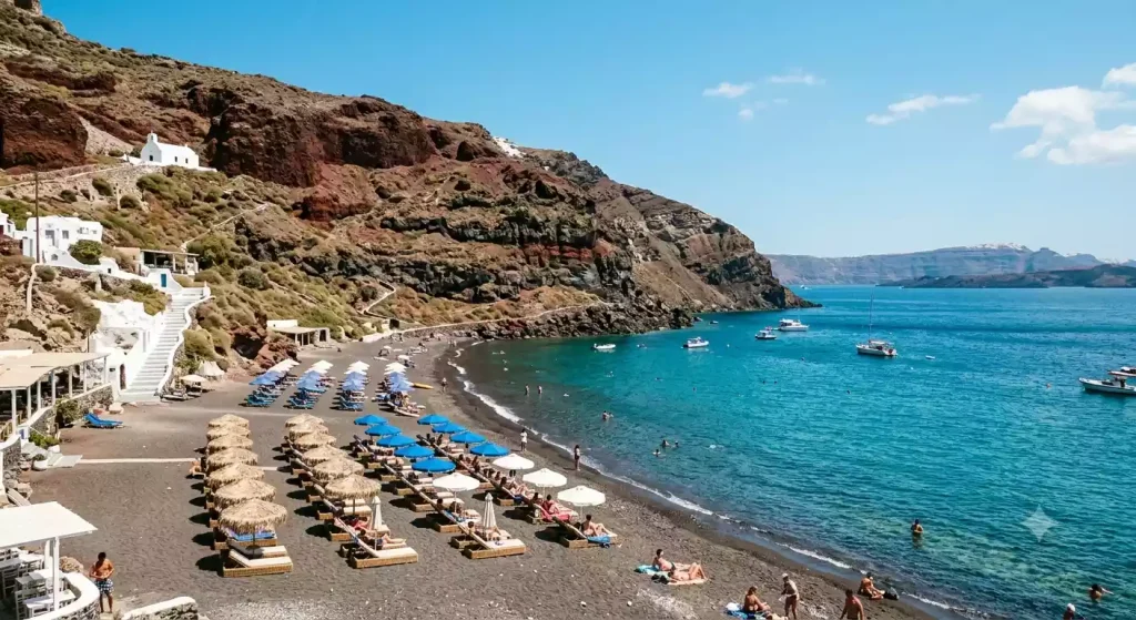 Black volcanic sand beach in Santorini
